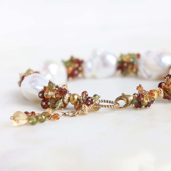 Close up of gold filled lobster claw clasp, twisted ring and extension chain